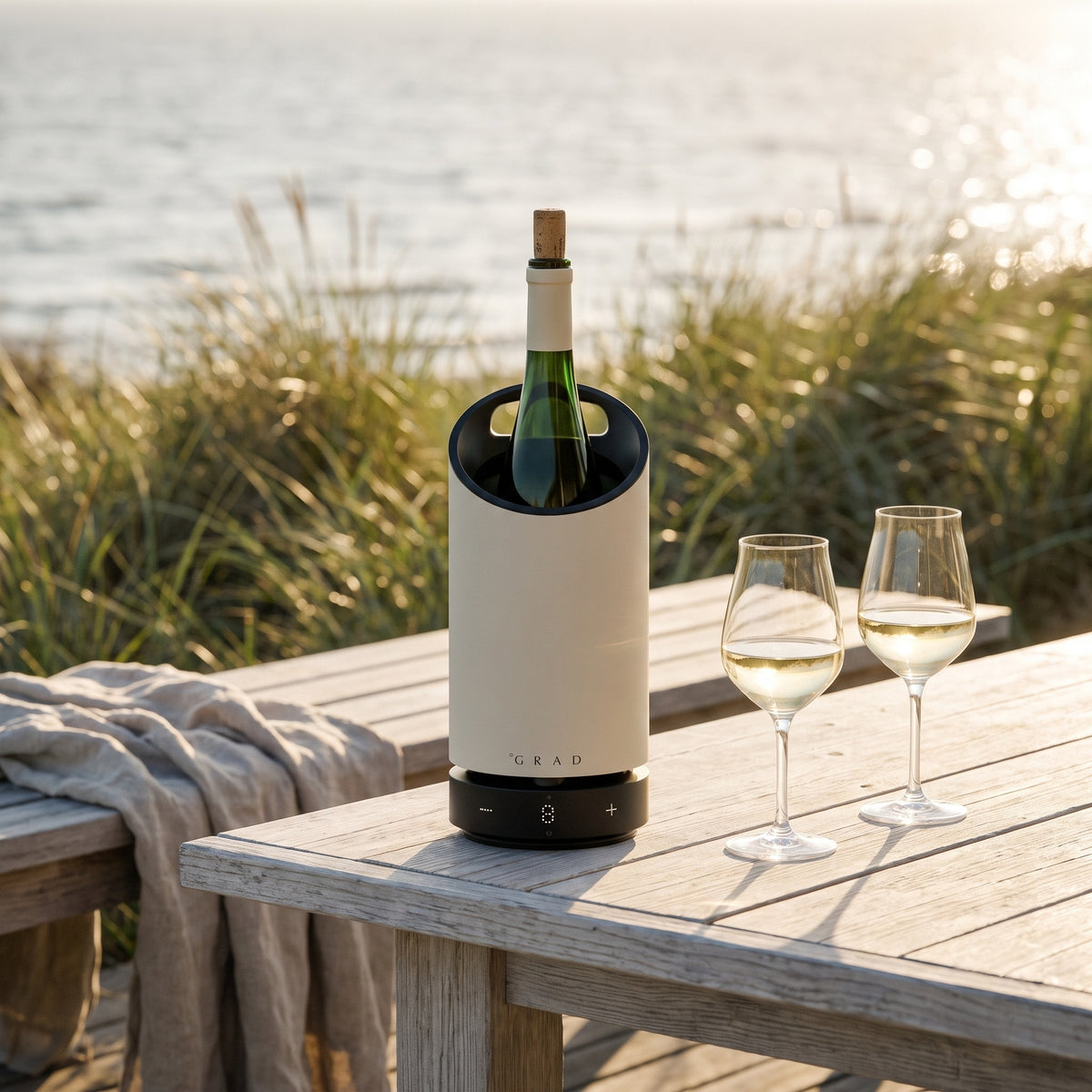 GRAD No.1 off-white wine cooler keeping rosé at serving temperature on a summer house terrace